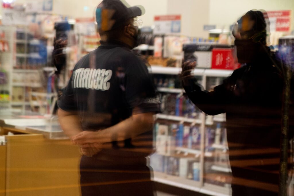 Security guards at a store working on anti-theft measures